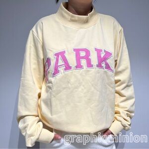 PARKE Cozy Cream Sweatshirt with Pink Accents